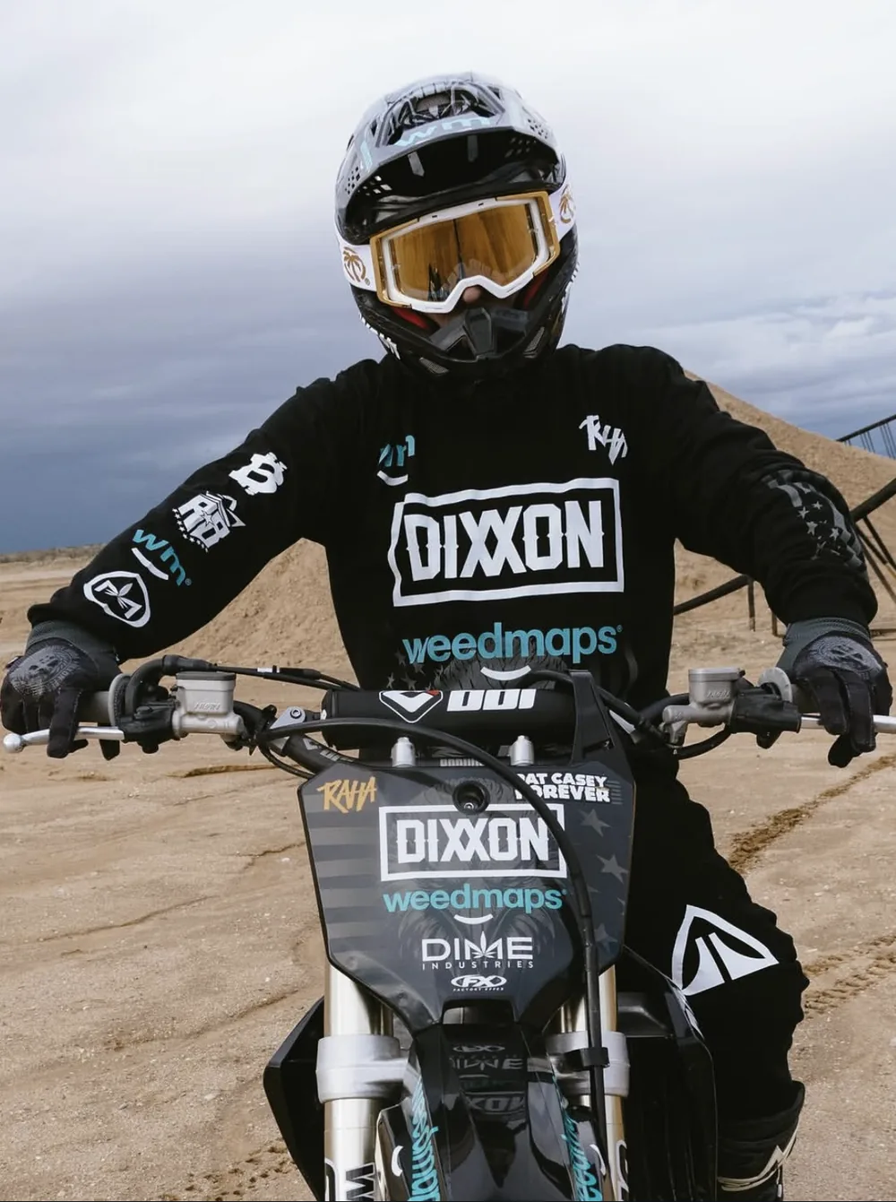 Colby on the dirt bike facing the camera in the jersey